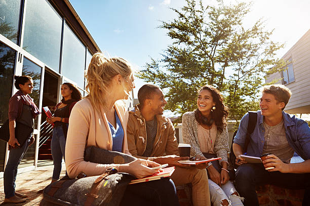 Shot of a group of students studying outside on campus